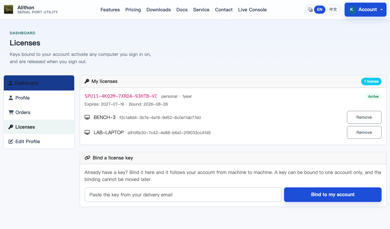 Dashboard > Licenses: a My licenses panel listing one personal 1-year key marked Active with its expiry and bind date, the two computers it is live on each with a Remove button, and below it a Bind a license key panel with a field for a key from the delivery email